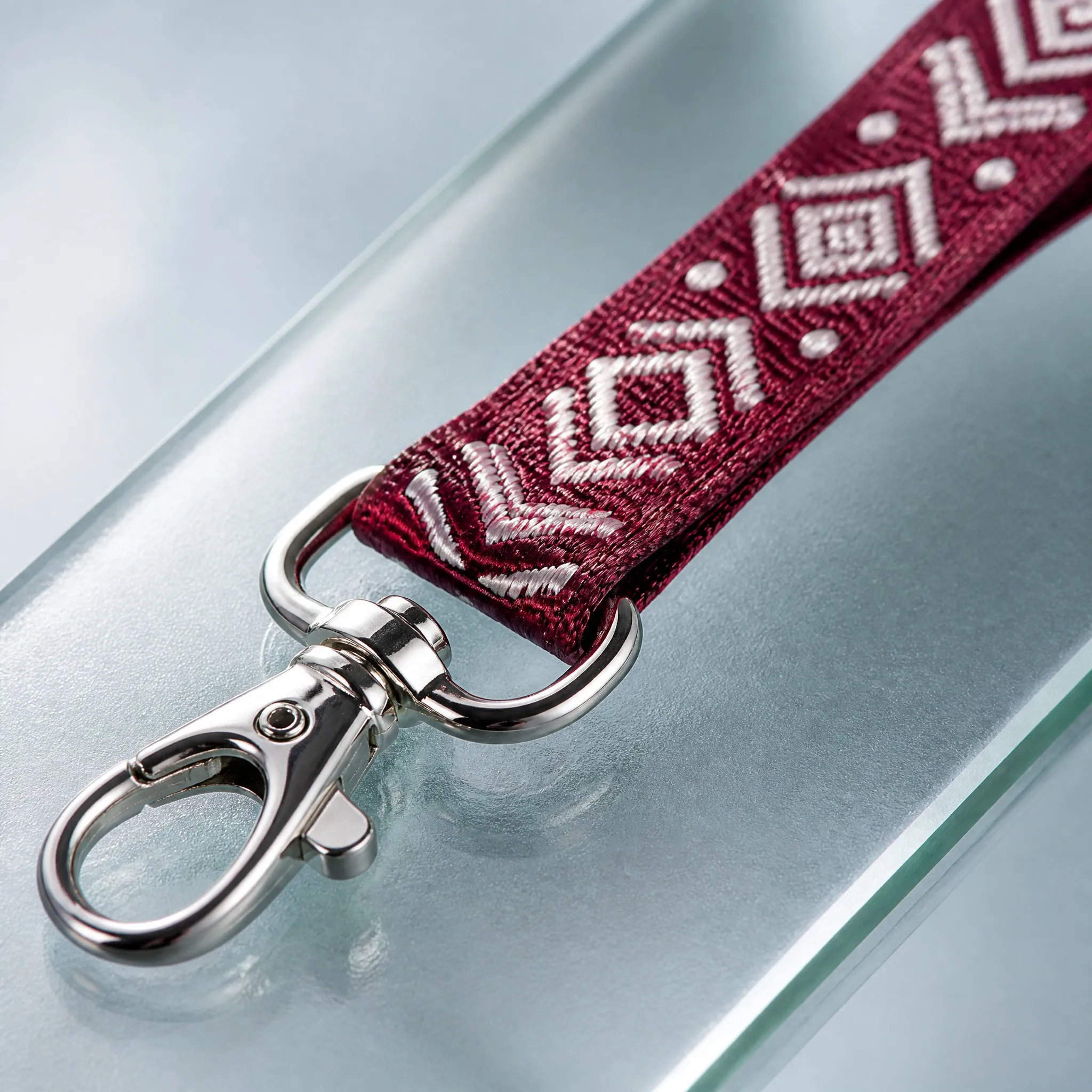 Close-up of raised woven dobby texture and polished metal swivel clip