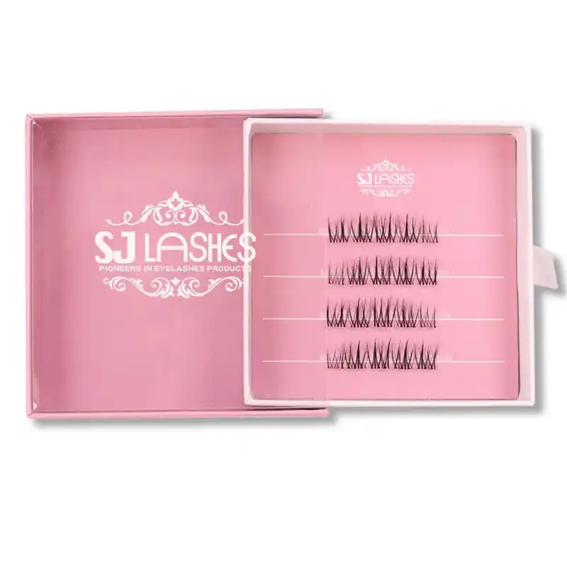 Close up of a pink slide out lash box, drawer pulled out showing a printed insert card with lash rows and a large white brand wordmark printed on the pink box interior - slide out lash box detail