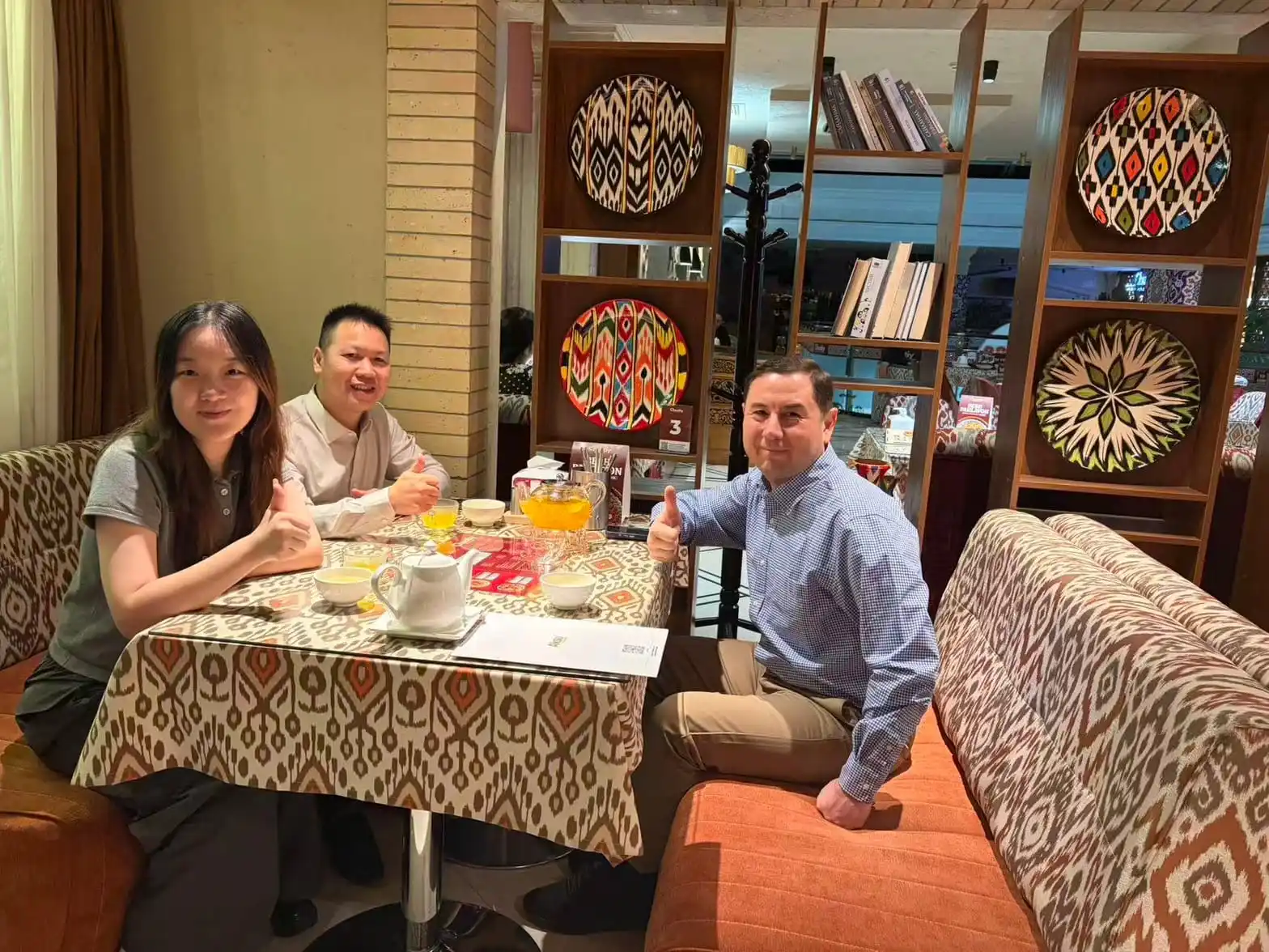 Dongbo New Energy representatives meeting a customer during a business visit in Uzbekistan