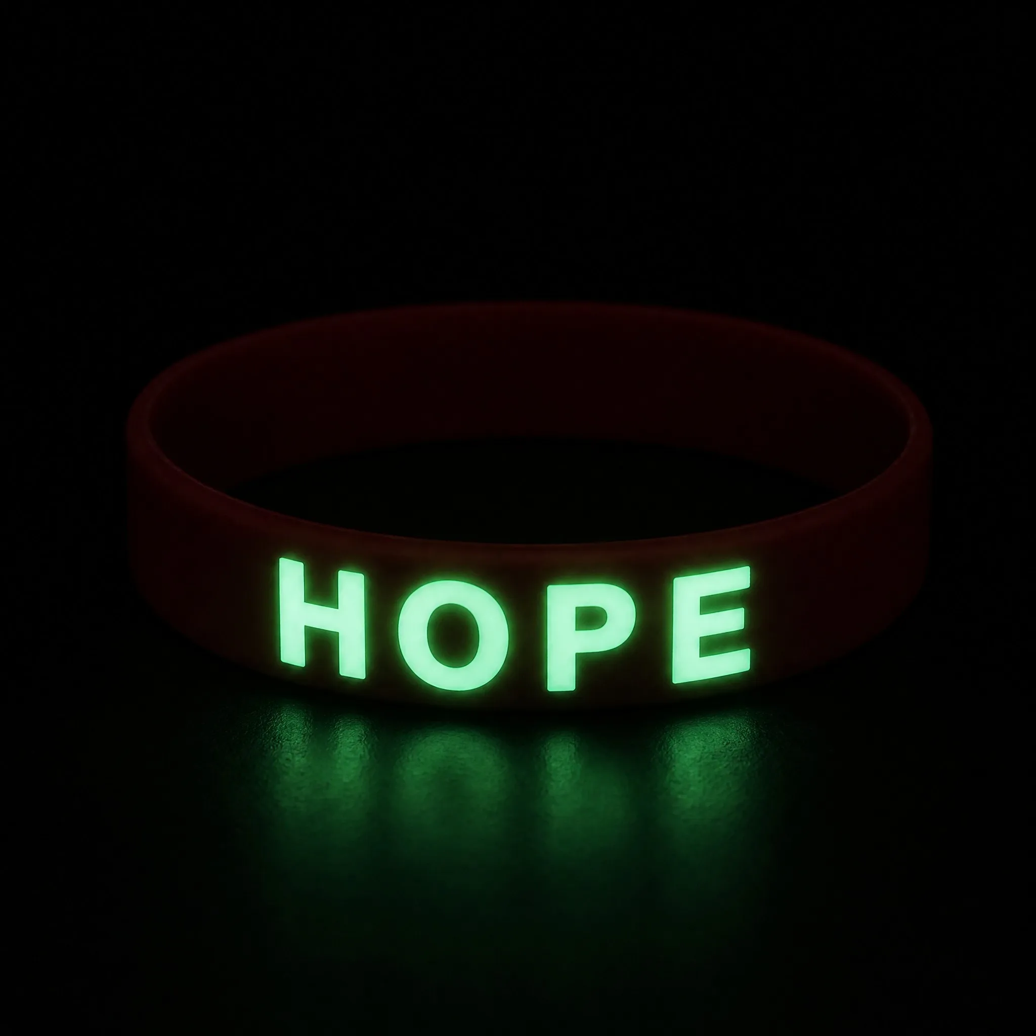 Glow in the dark silicone bracelet glowing in a dark environment