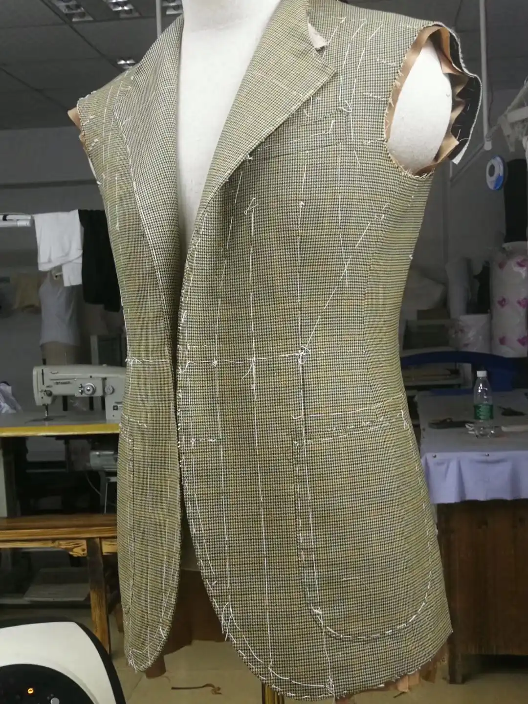 Hand-cut buttonholes on bespoke suit