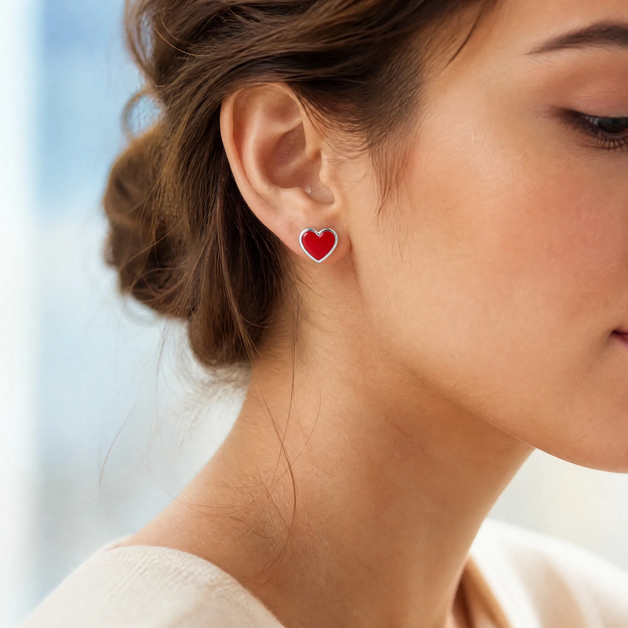 Wearing hard enamel heart stud earrings