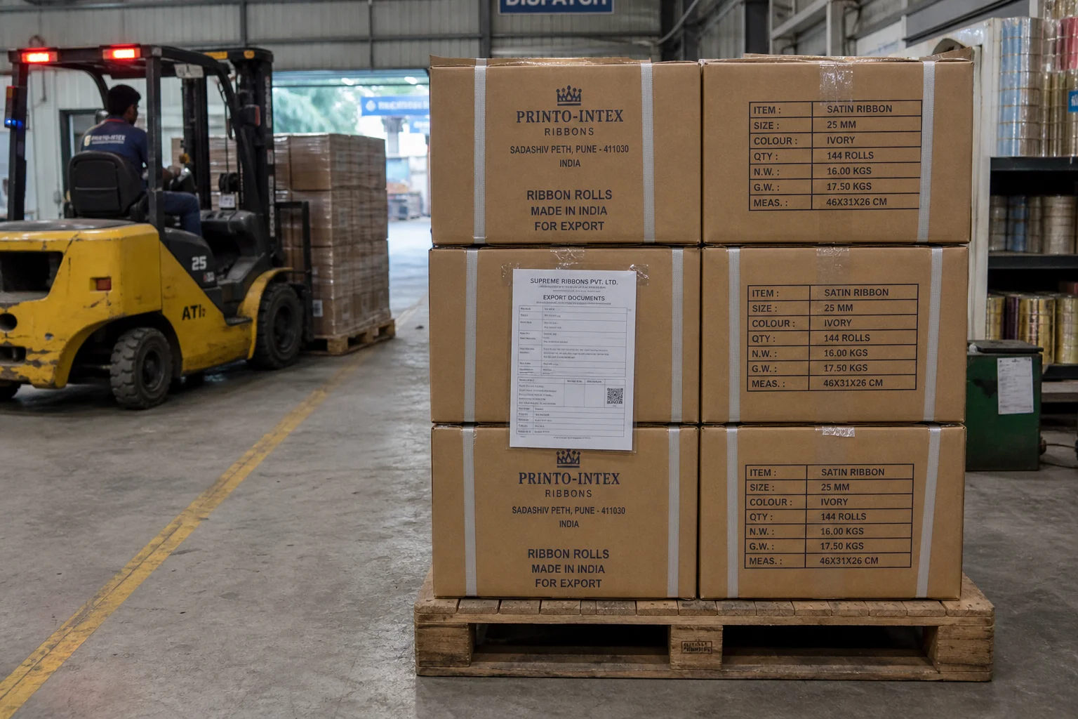 Ribbon mill dispatch area with export cartons on pallets