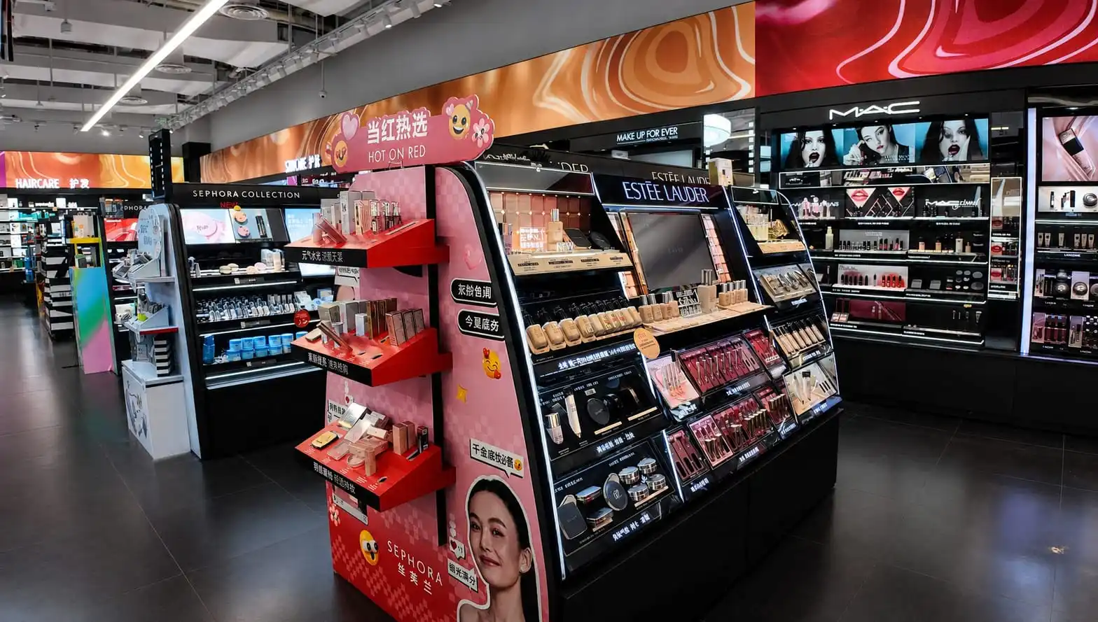 Beauty and cosmetics retail fixtures with lit display cases