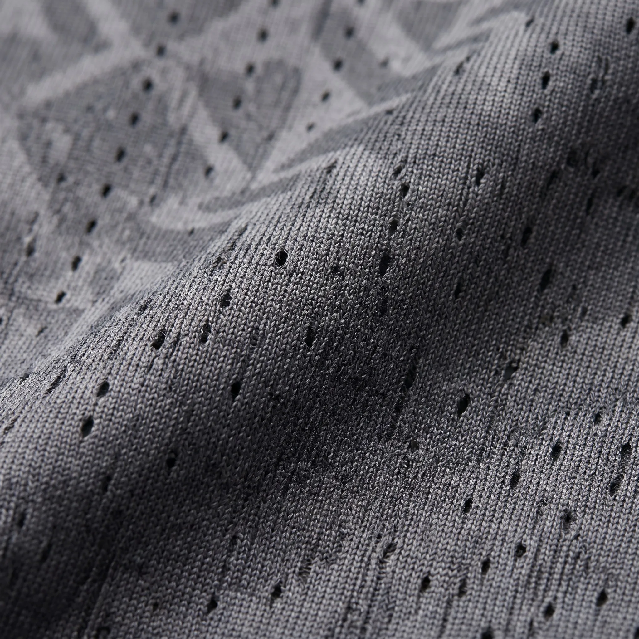 Macro detail of breathable mesh and jacquard fabric pattern