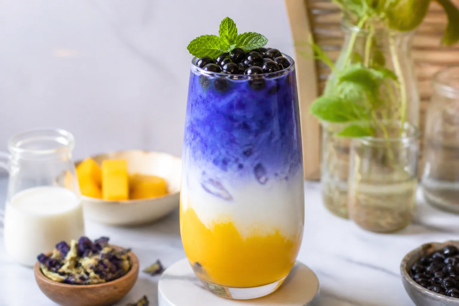 Layered creative butterfly pea flower mocktail and bubble tea