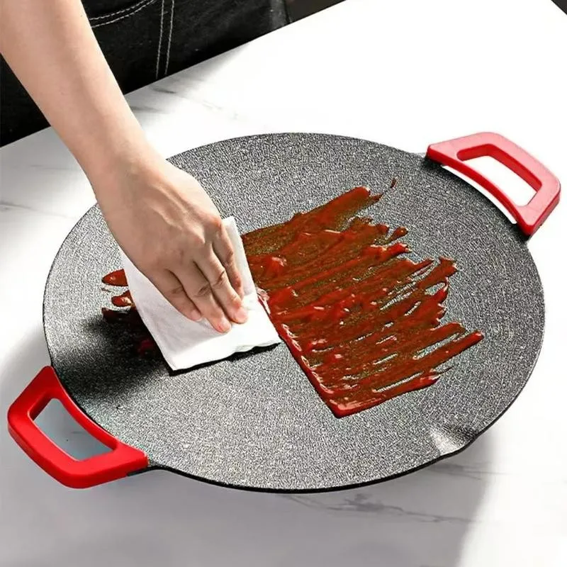 Wiping the grill clean
