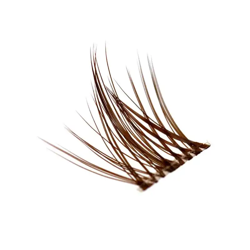 Close-up of a single brown lash cluster fan showing the flat base and the individual fibre tips - lash cluster fan close up