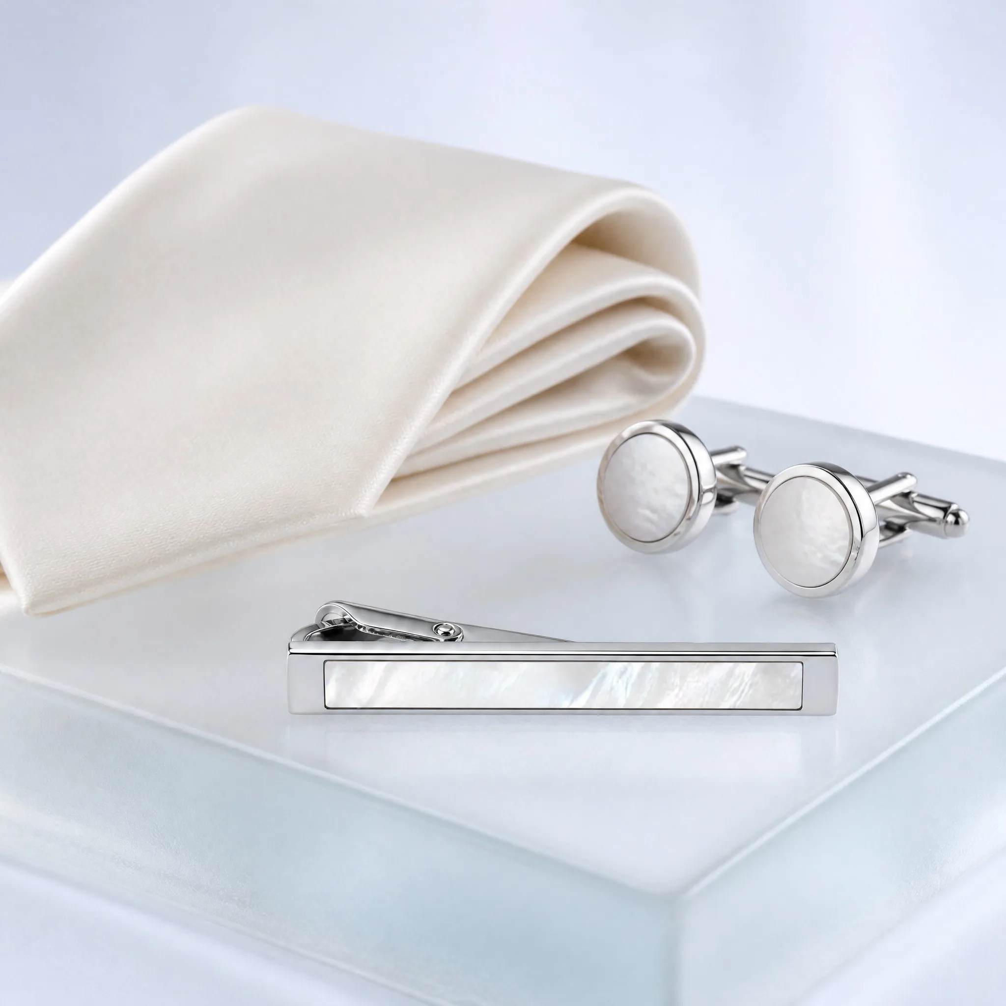 Mother of pearl tie clip gift scene with tie and cufflinks