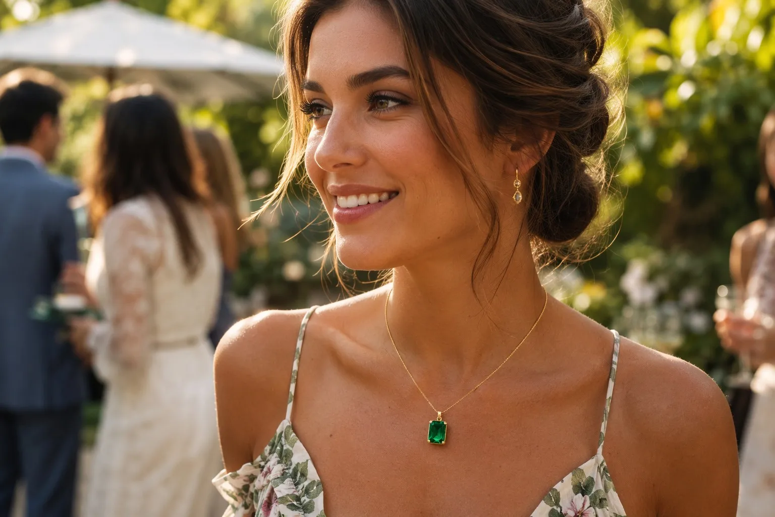 Woman wearing lab-grown emerald jewelry in a garden setting