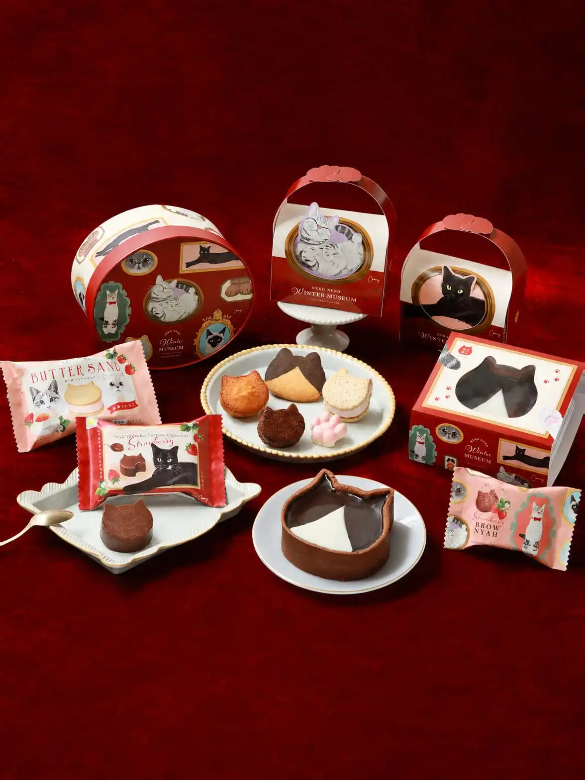 The NEKO NEKO Winter Museum 2026 collection arranged on deep red satin