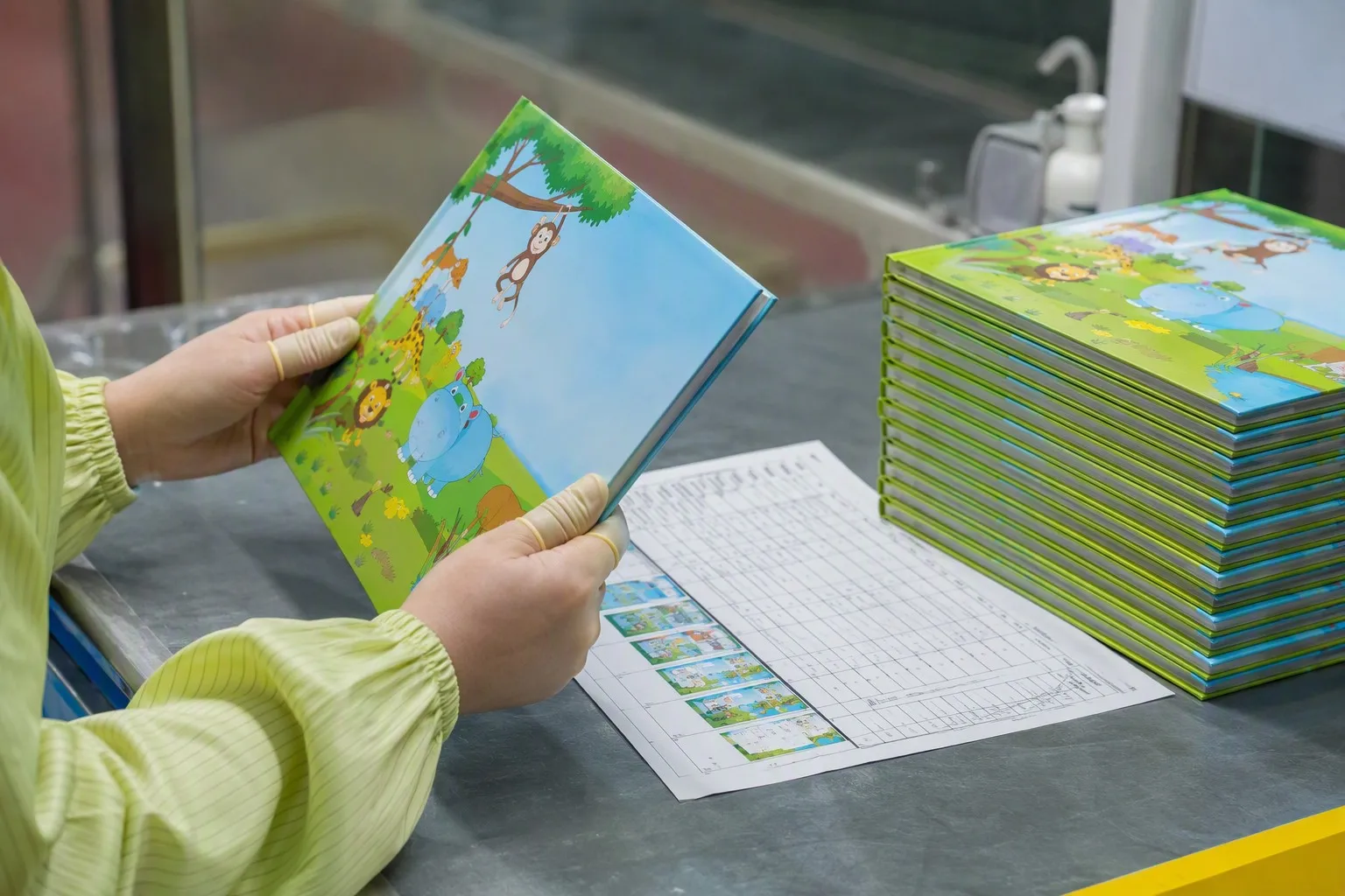 Quality inspector checking finished children's books against checklist