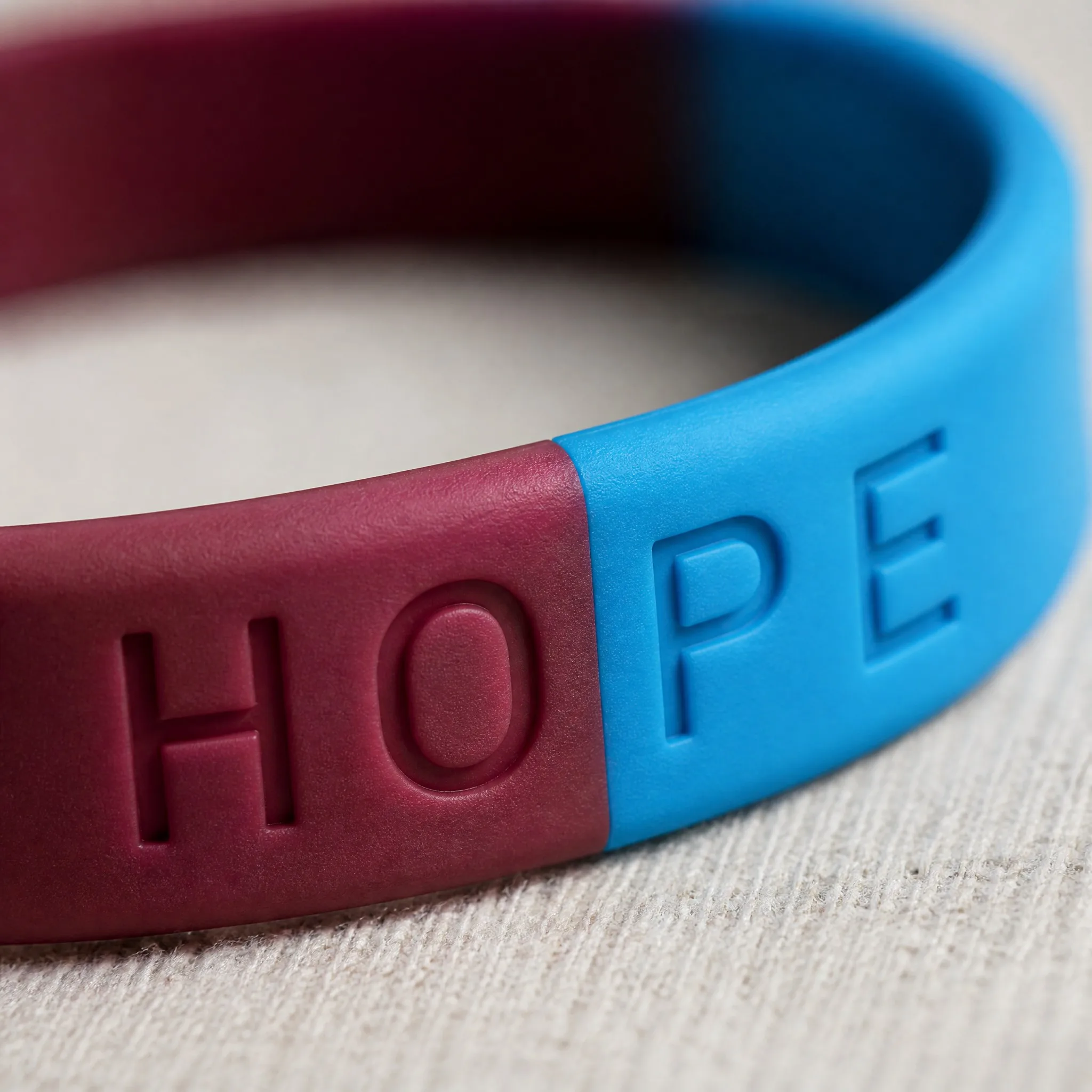 Macro detail of the seamless two-tone color boundary on silicone bracelet