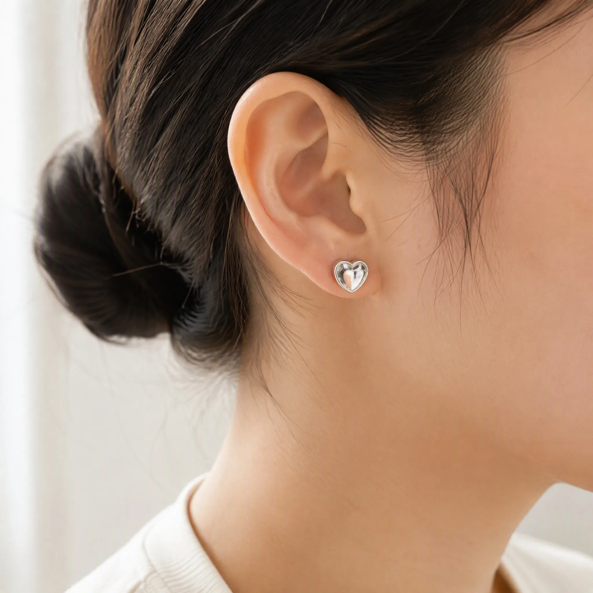 Wearing epoxy resin heart earrings