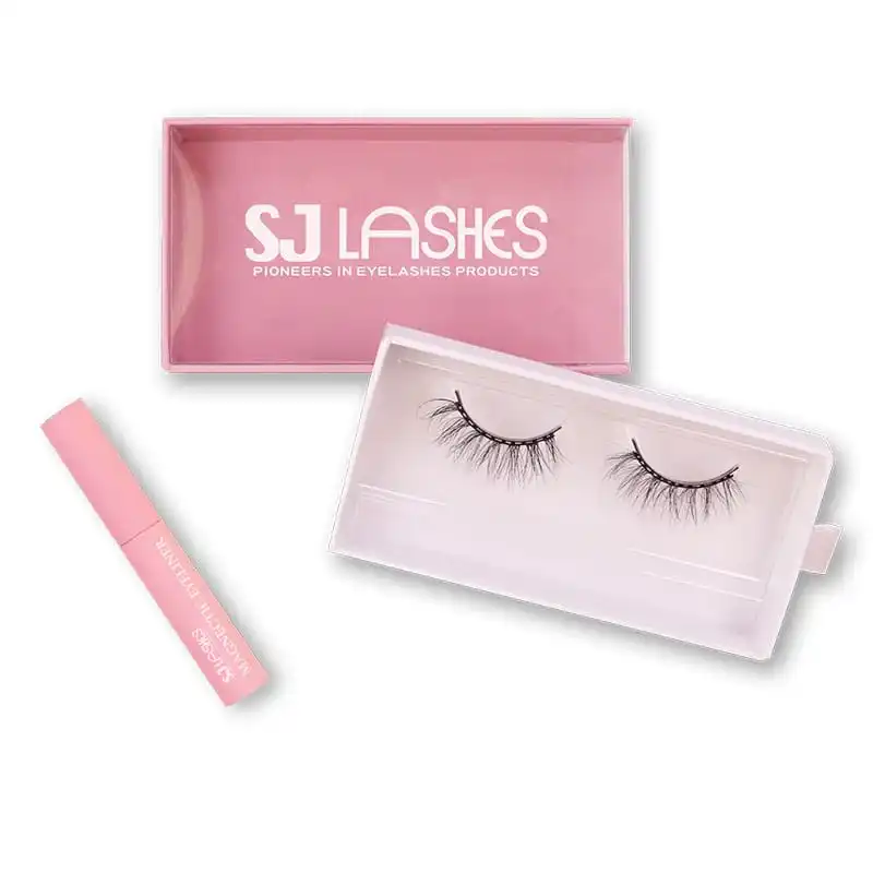 Pink lash box with a pale formed paper tray insert holding one pair of lashes, pink magnetic eyeliner tube beside it and a white pull tab on the tray - lash box with paper tray