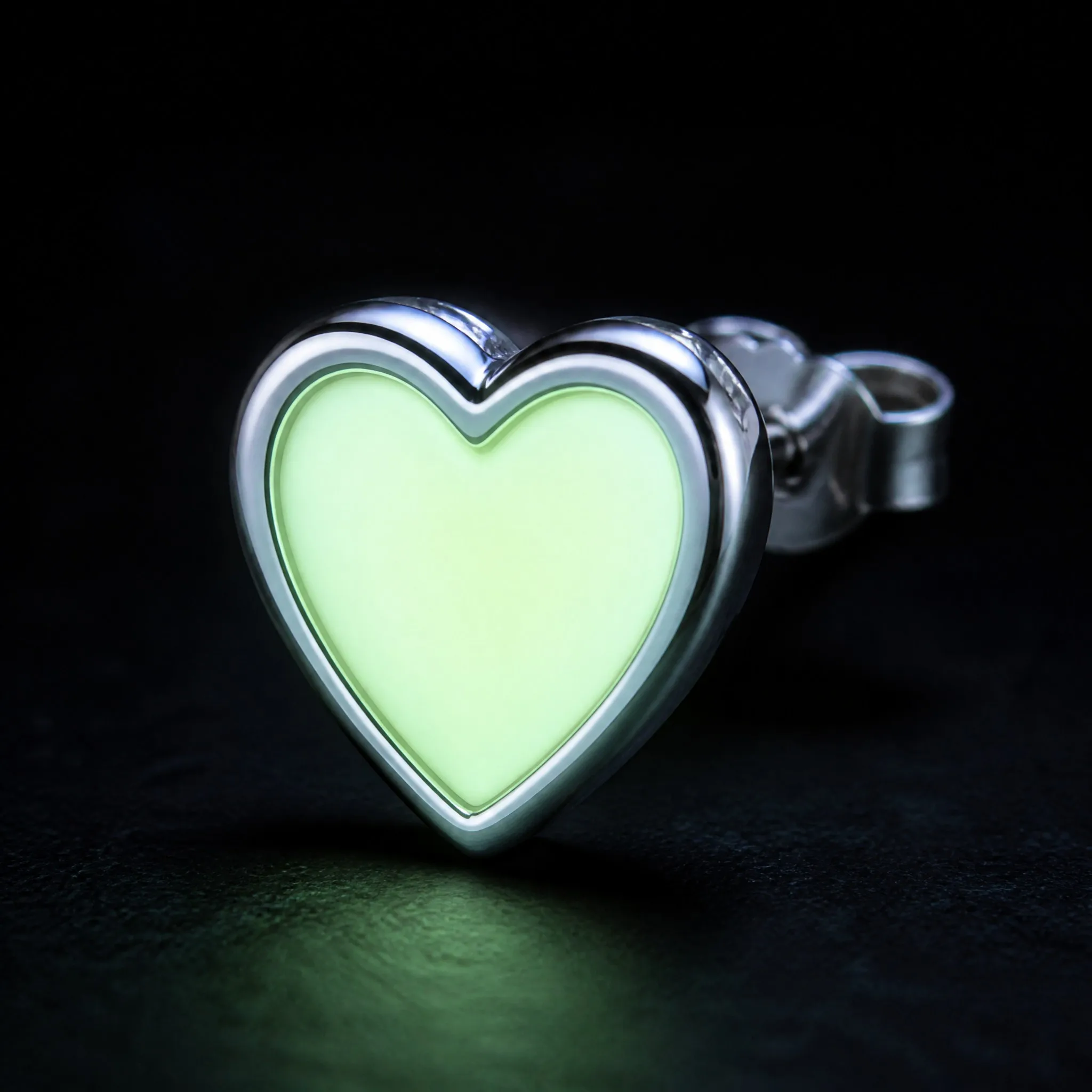 Glow heart earring glowing in the dark