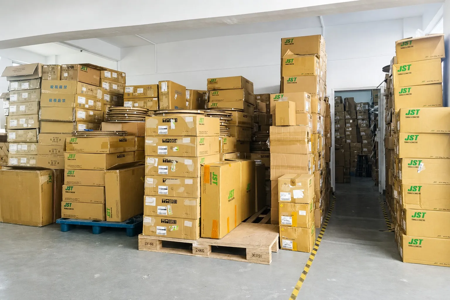 By Technology warehouse — JST Molex connector inventory on pallets