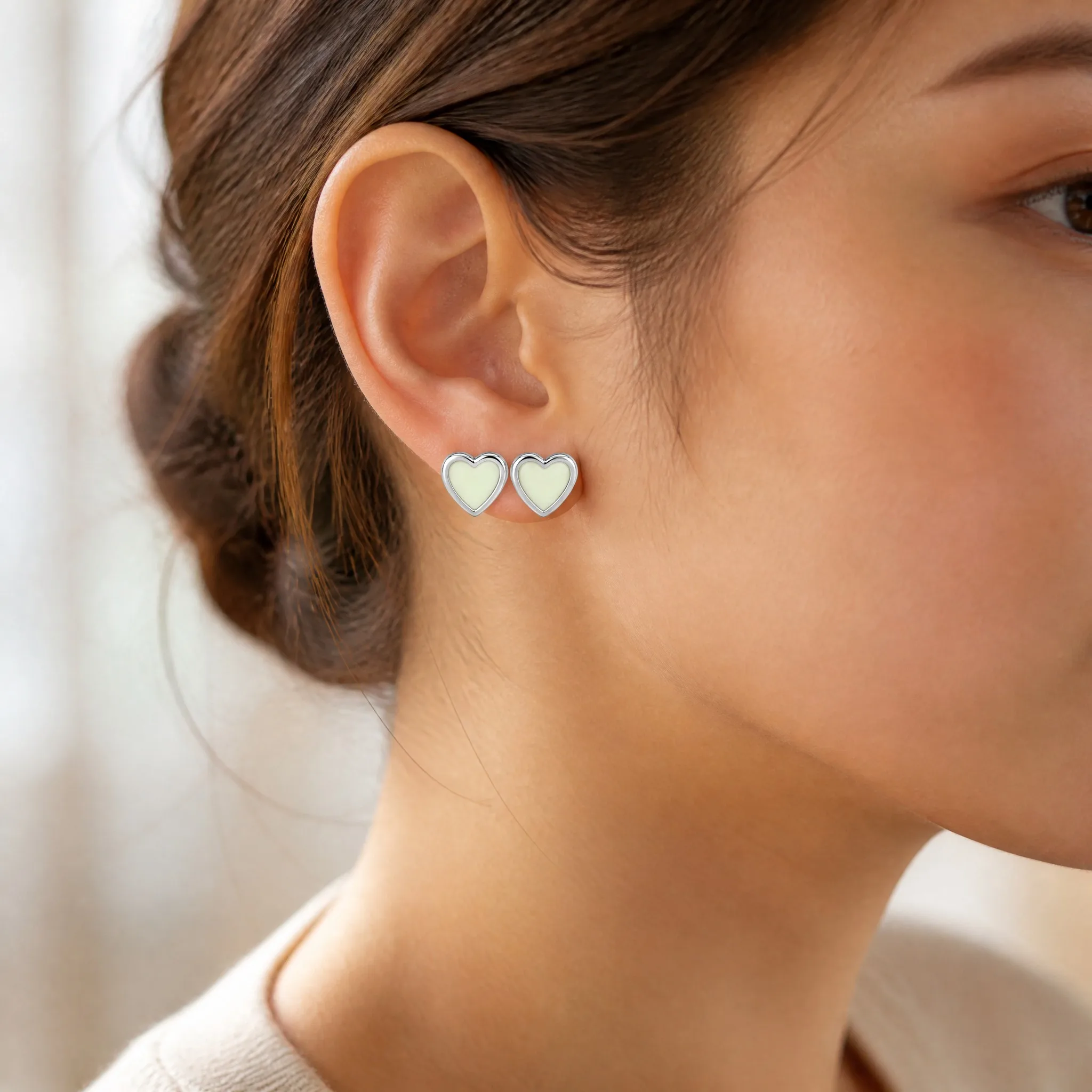 Wearing glow heart earrings