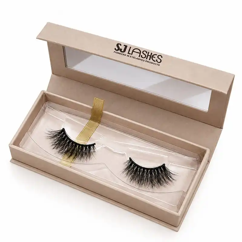 Open kraft single pair lash gift box with a clear window set into the lid, visible insert tray holding the pair and a gold ribbon pull tab, brand wordmark on the lid interior - kraft lash gift box