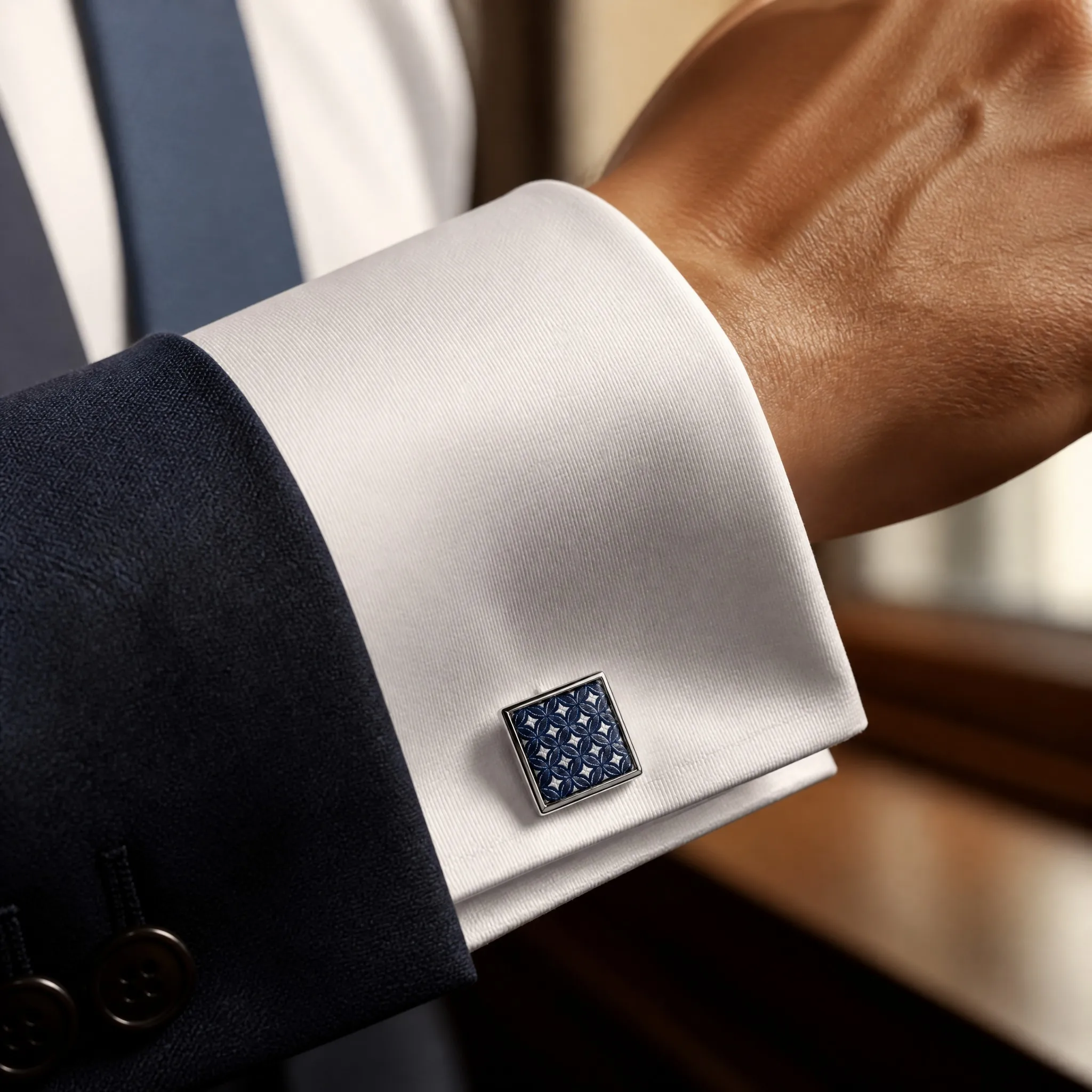 Silver silk print cufflinks worn on white dress shirt cuff