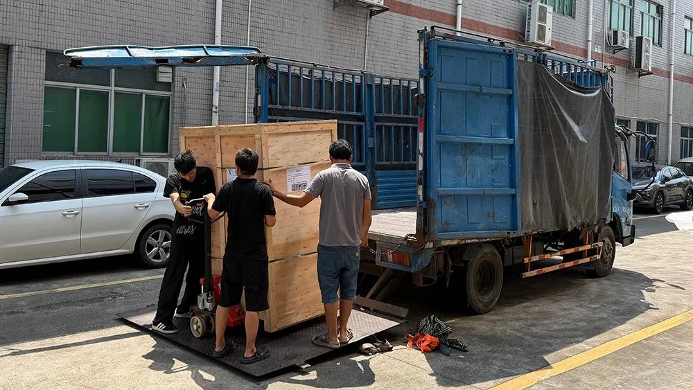 Wooden shipping crate containing the Derui DR-IPX56-225 sand dust test chamber being loaded onto a truck for shipment to Spain