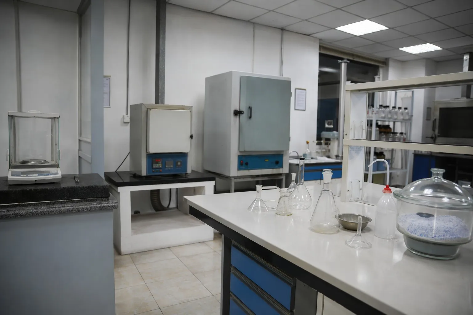 Real chemical quality control laboratory with analytical testing equipment