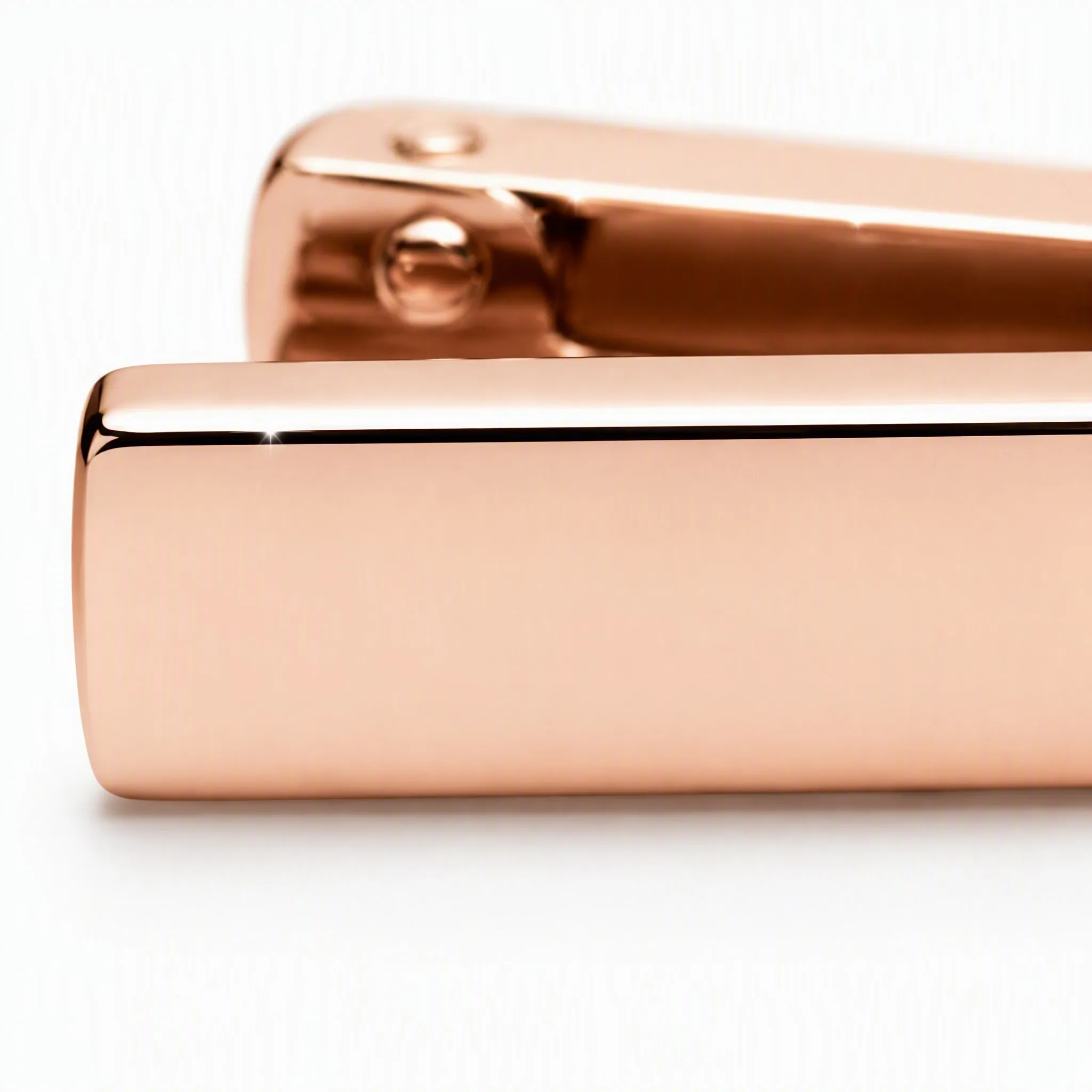 Macro detail of rose gold mirror polished surface