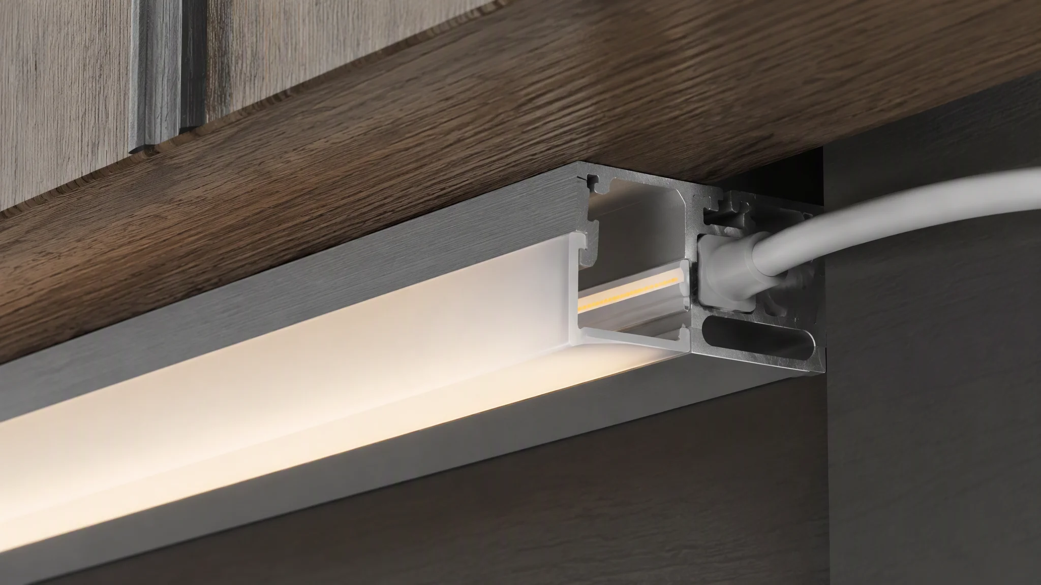 COB LED strip seated in an aluminium profile with diffuser and protected cable exit
