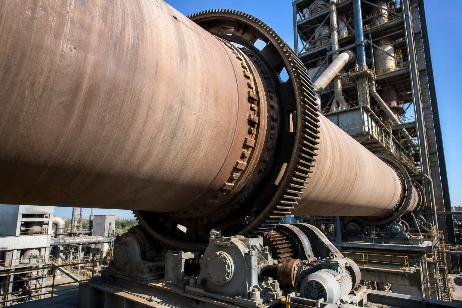 Industrial rotary kiln operating in cement plant with large cast girth gear drive