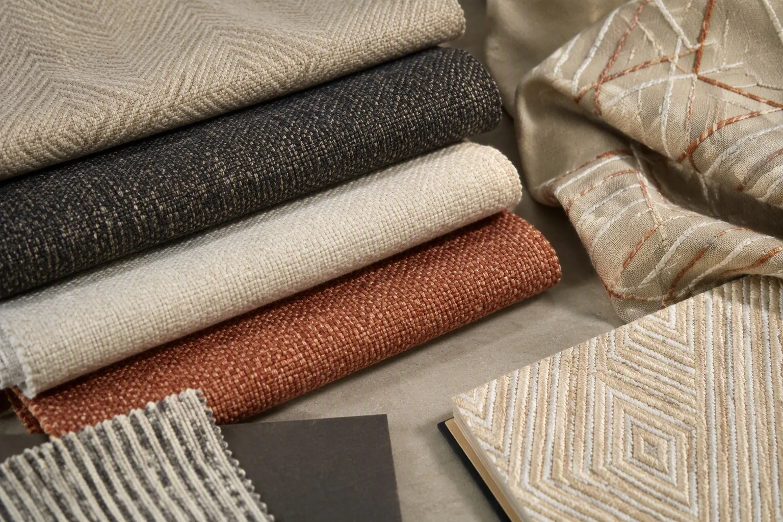 Textured upholstery and embroidered interior fabric swatches