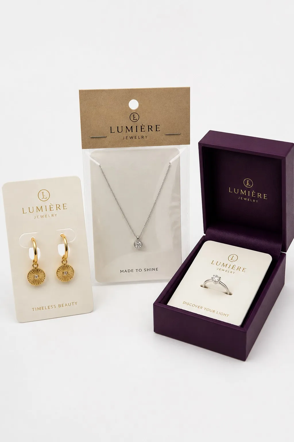 Earring card with gold earrings, kraft header card on a PVC bag, and rigid box with insert card