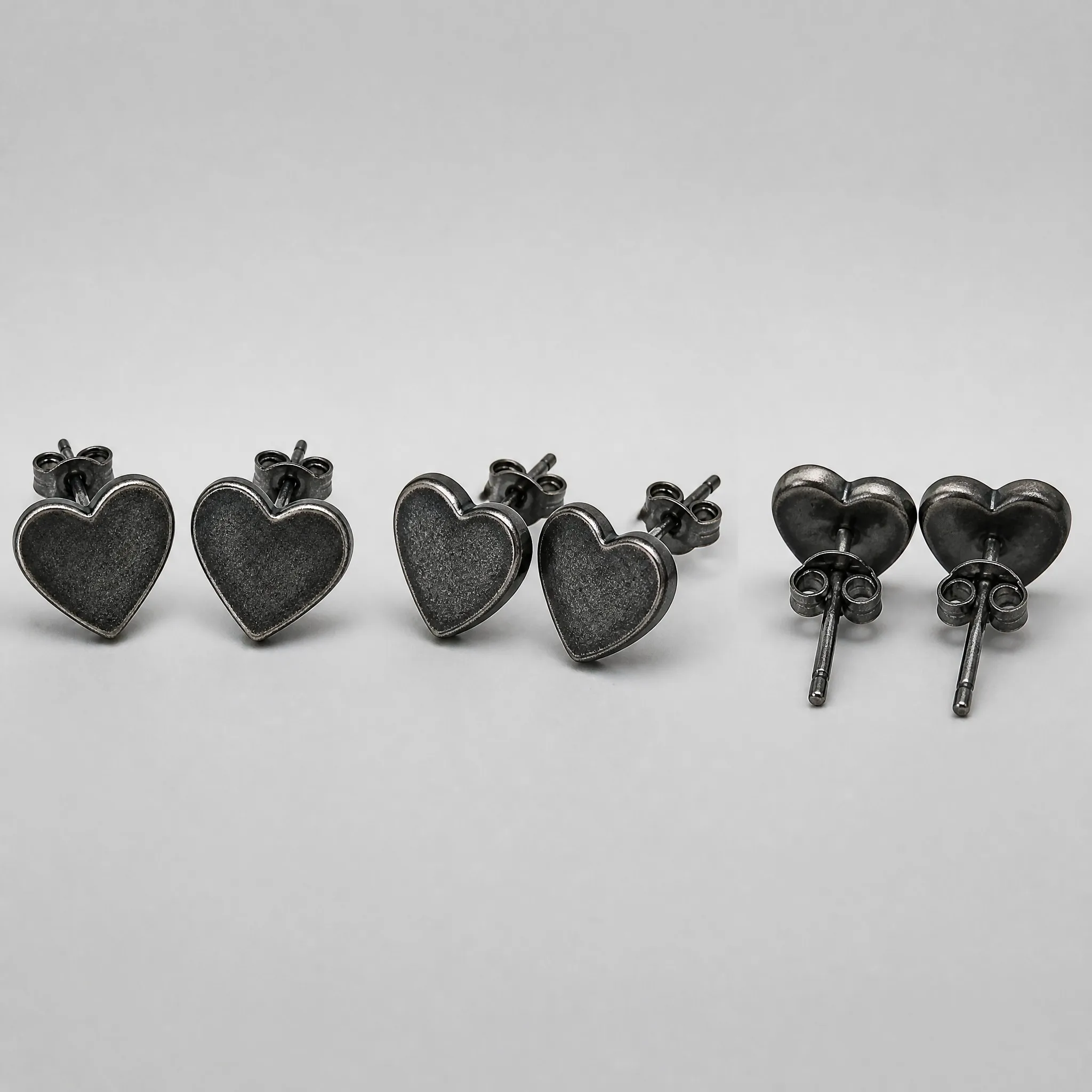 Oxidized black heart earrings multi-angle view