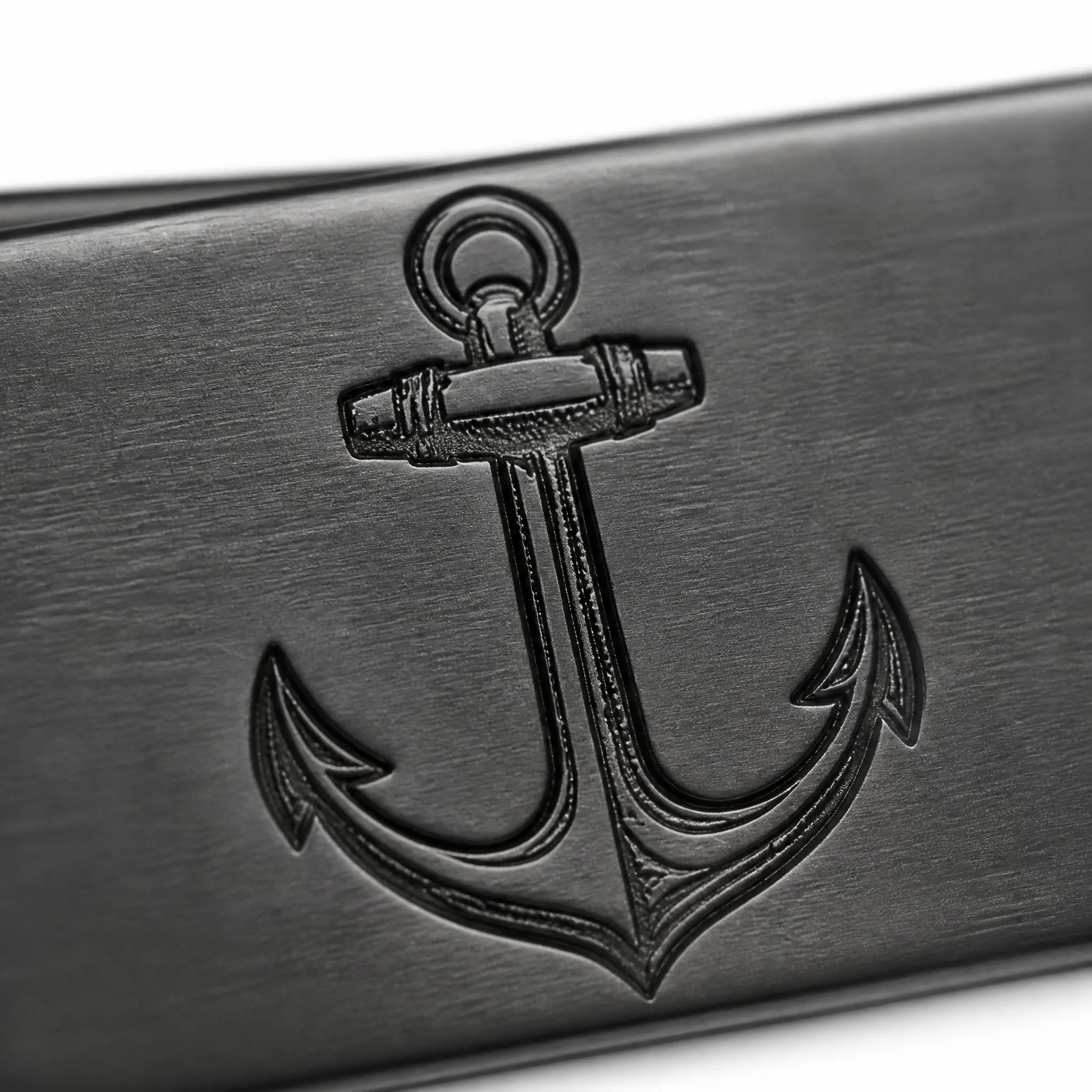 Macro detail of laser engraved anchor motif