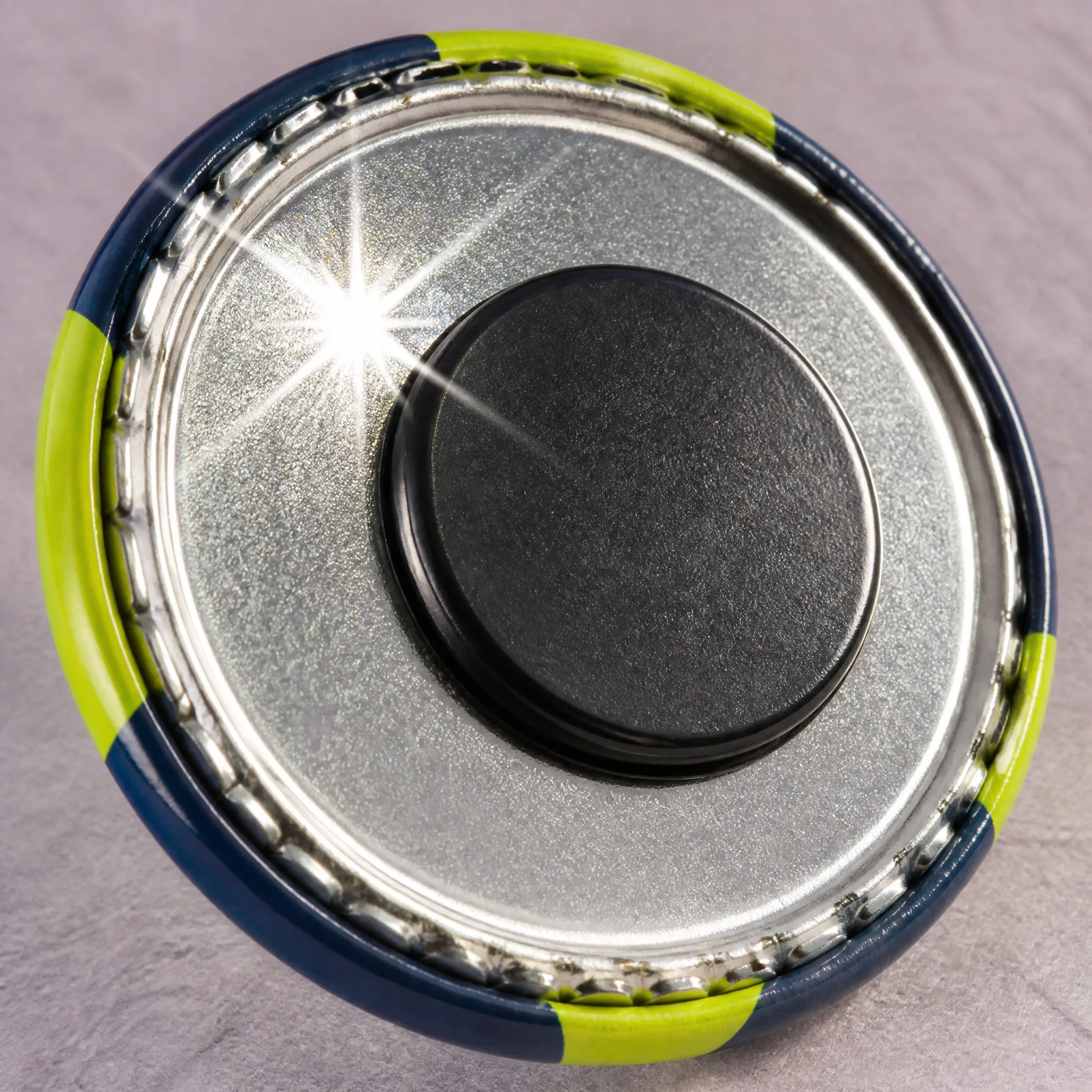 Reflective coating and magnetic back detail of button badge