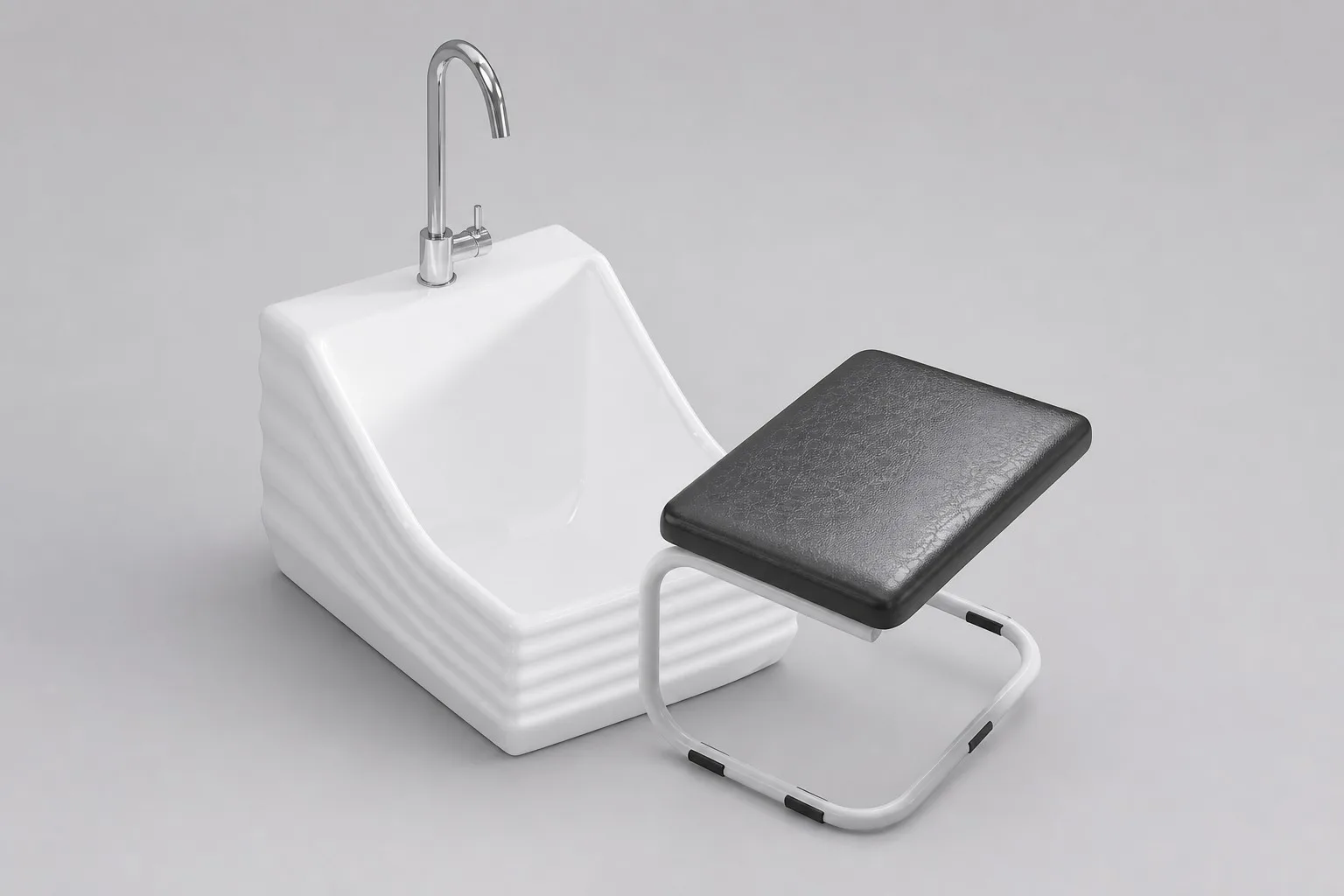 Low white ceramic wudu basin with a padded stool, wall-hung style