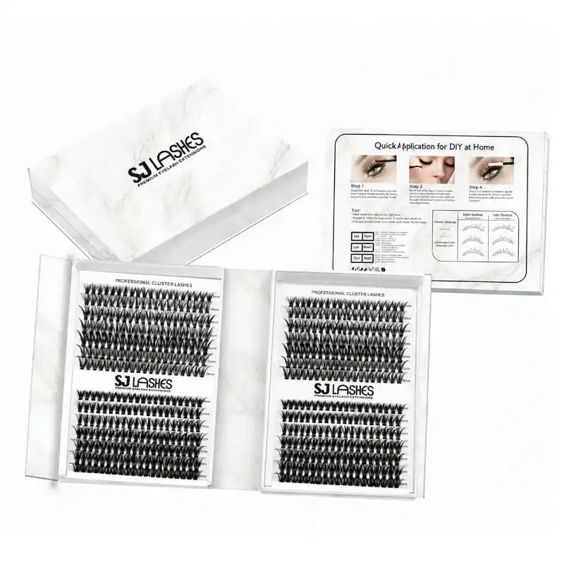 White marble effect bifold lash gift box opened flat, printed cluster lash panels with the brand mark, application card alongside - marble bifold lash gift box