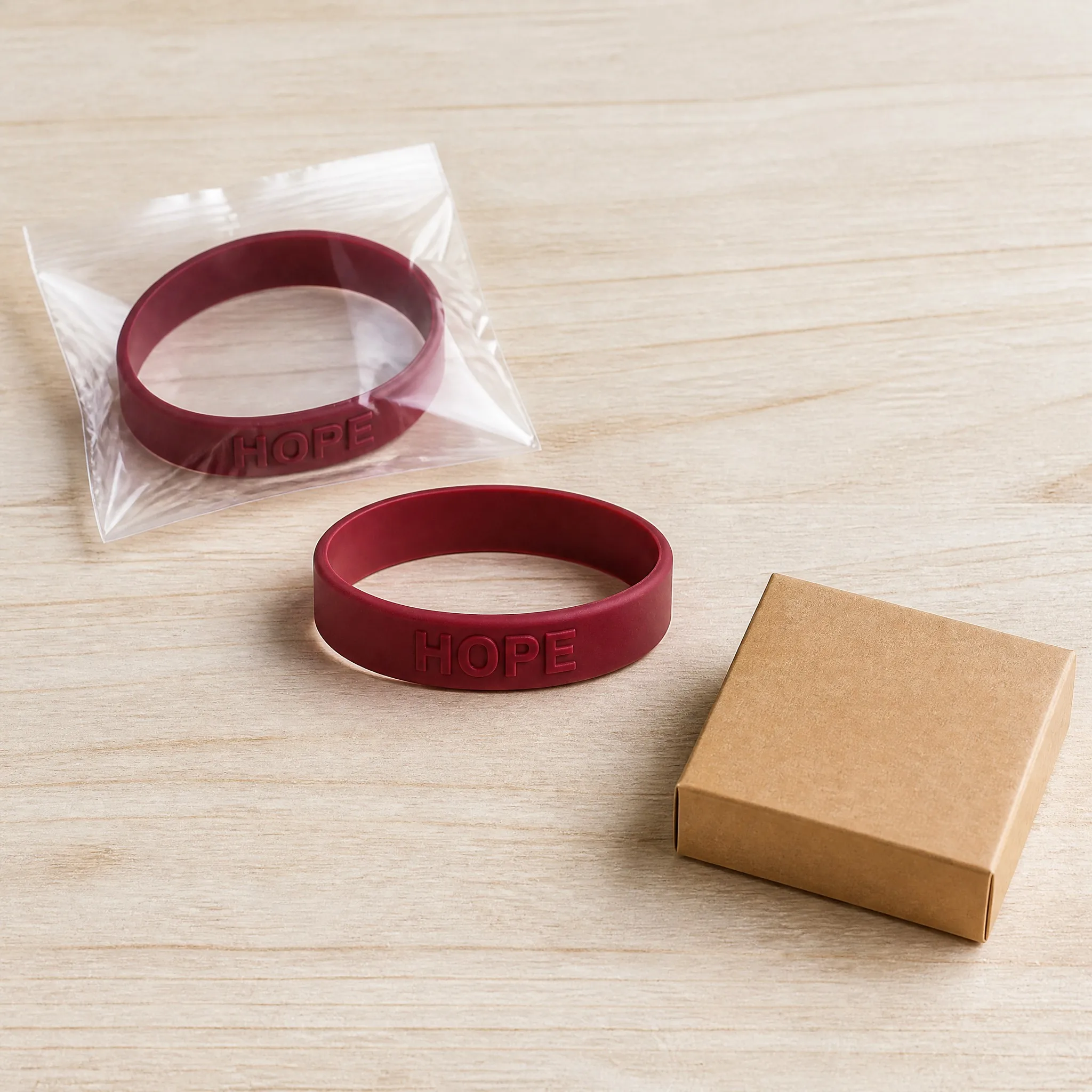 Custom embossed silicone bracelet in OPP pouch and kraft box packaging