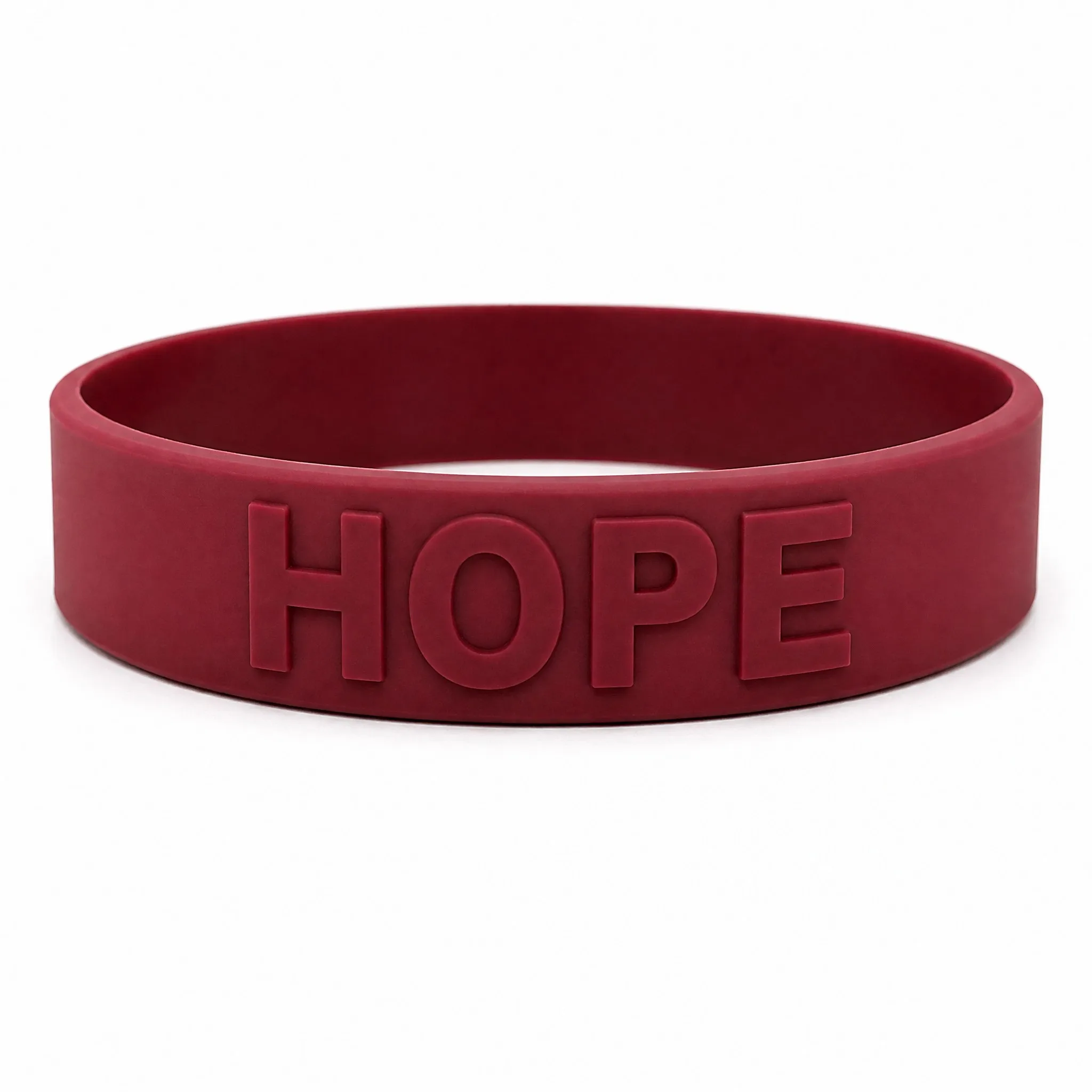 Custom embossed silicone bracelet with raised HOPE lettering on white background