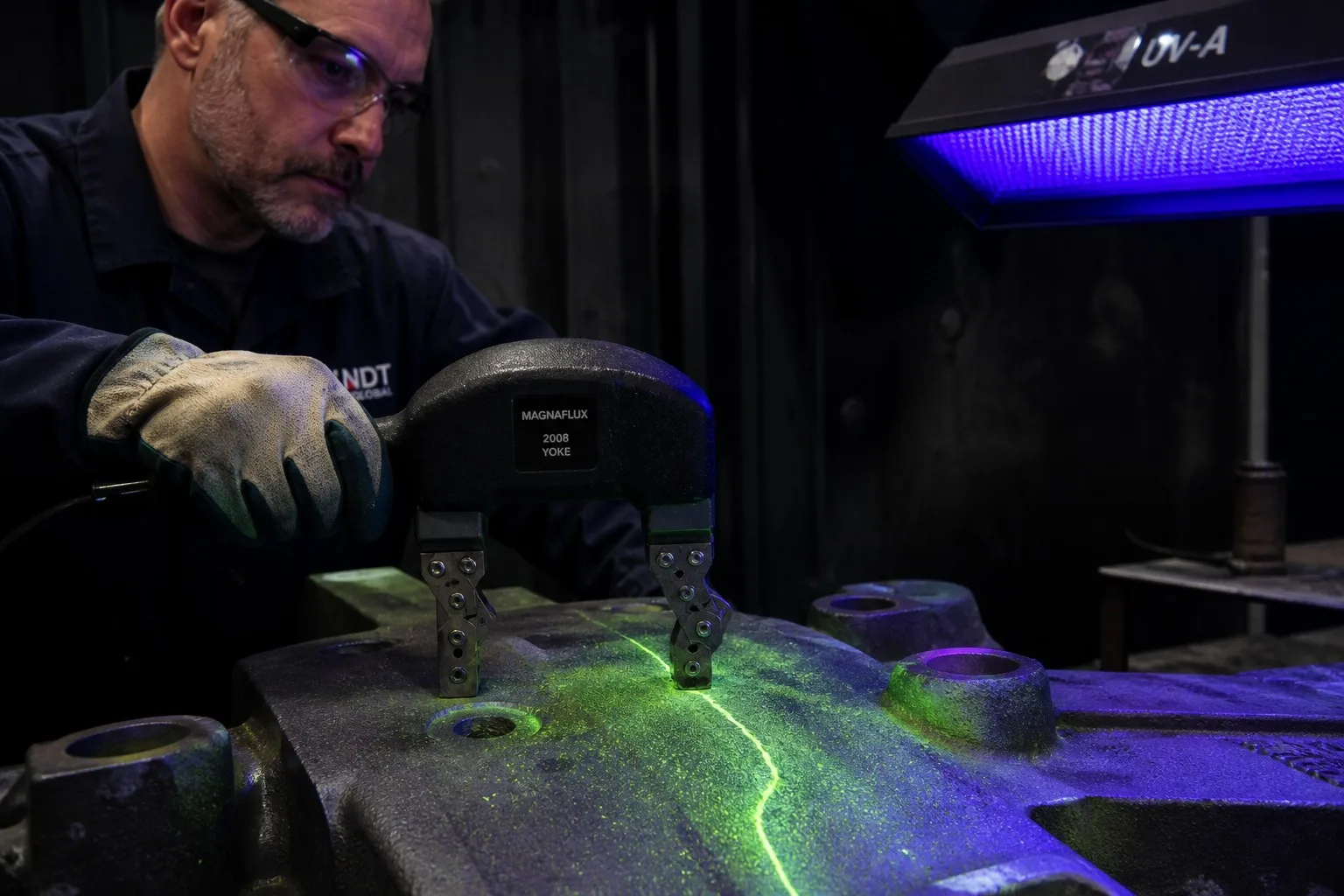 Magnetic particle inspection (MT) revealing crack indication on steel casting
