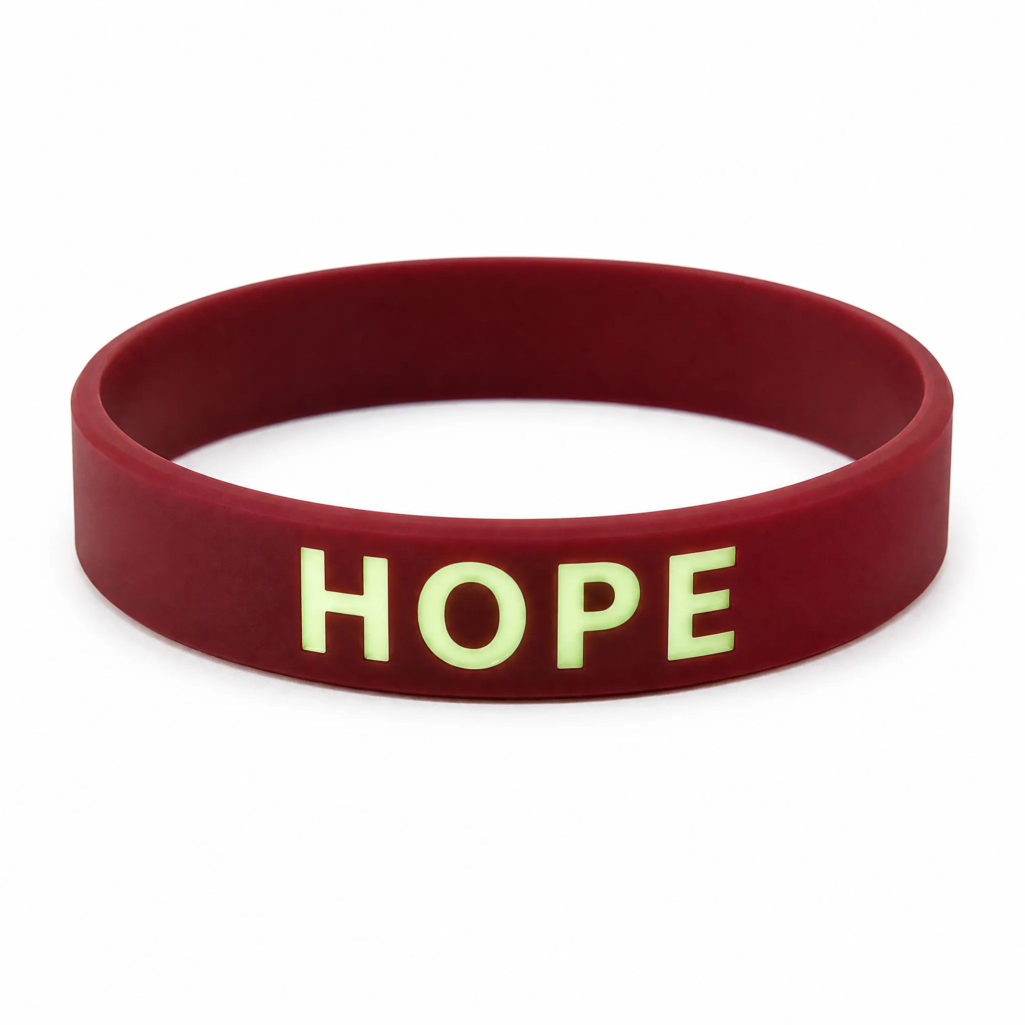 Custom glow in the dark silicone bracelet with phosphorescent HOPE lettering on white background