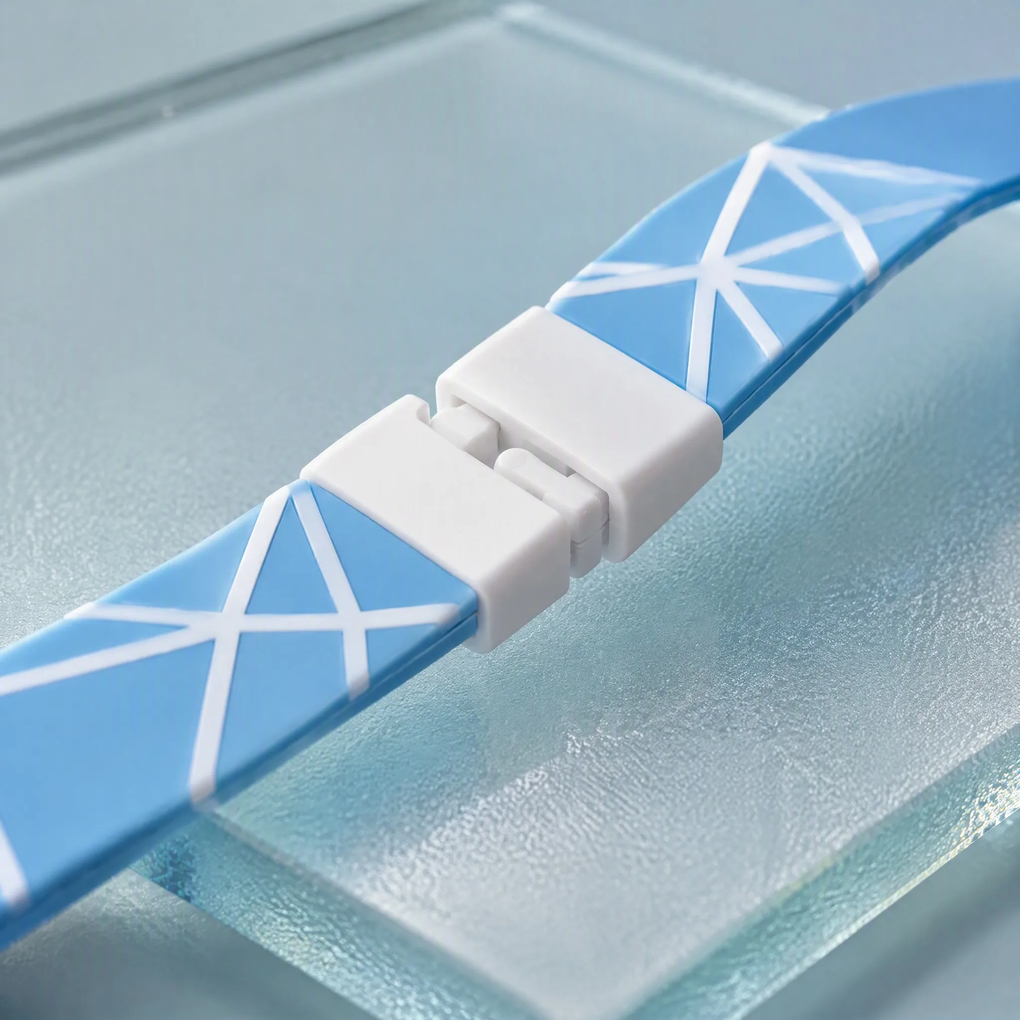 Close-up of smooth silicone strap texture and white breakaway safety clip