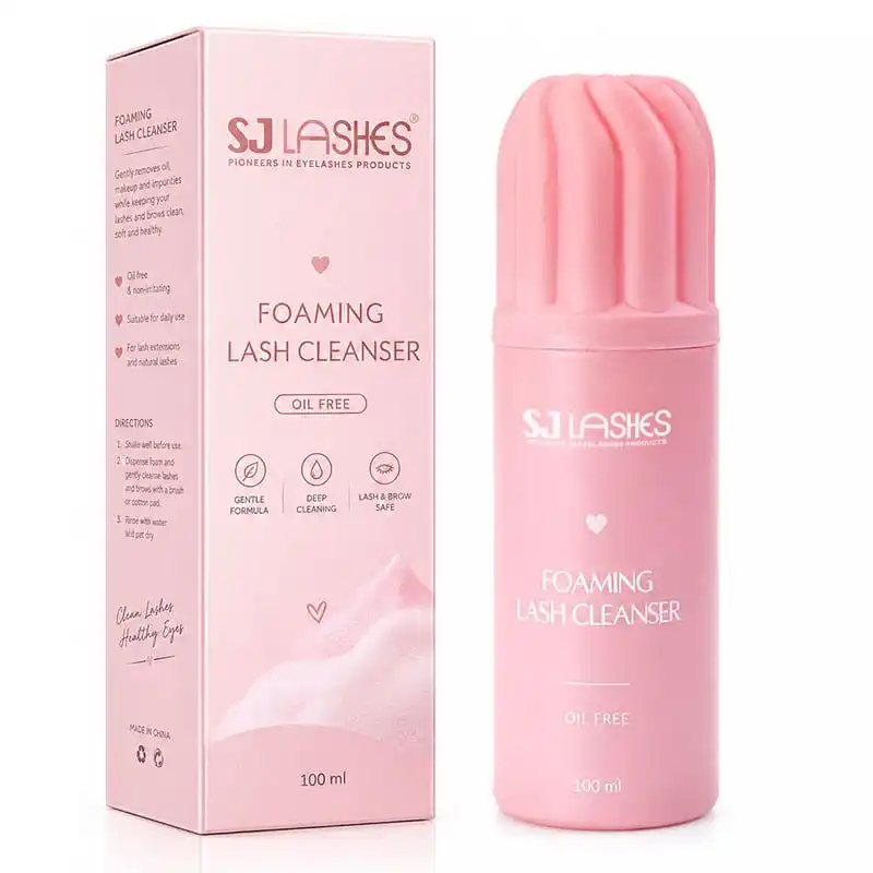 Pink foaming lash cleanser 100ml bottle with petal-shaped pink pump beside its pink paper box marked oil free, gentle formula, deep cleaning and lash and brow safe - custom private label lash cleanser packaging