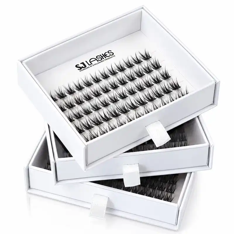 Three white slide-out lash boxes pulled open showing segment trays and white pull tabs - custom pull-tab drawer lash packaging OEM