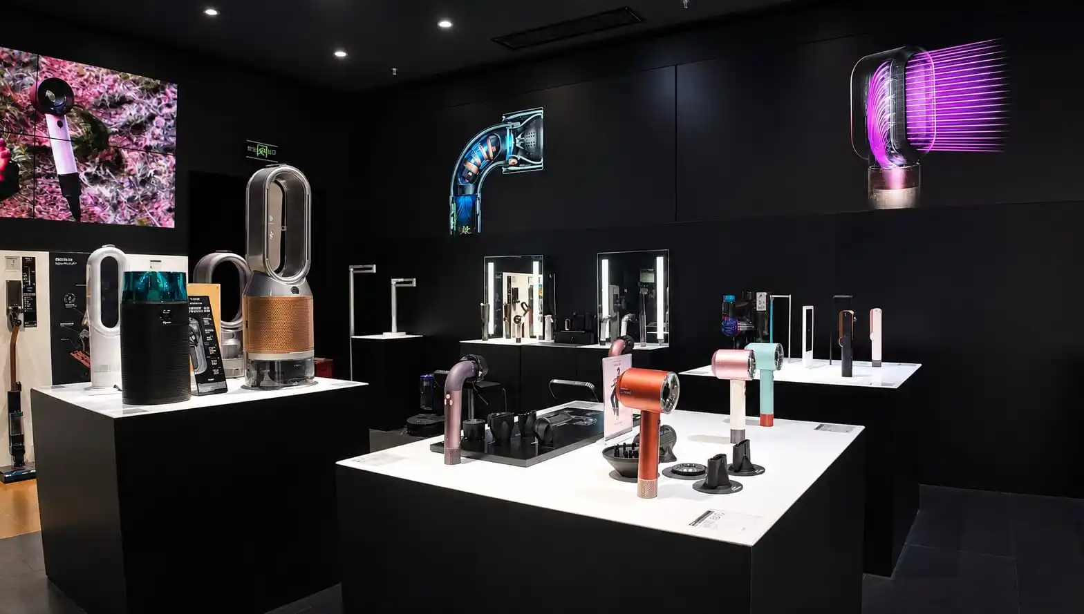Consumer electronics experience zone with product display tables