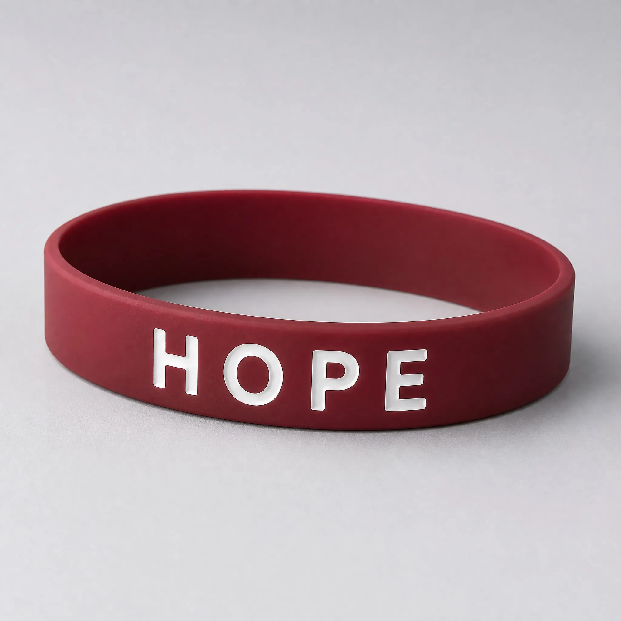 Three-quarter angle view of color filled silicone bracelet