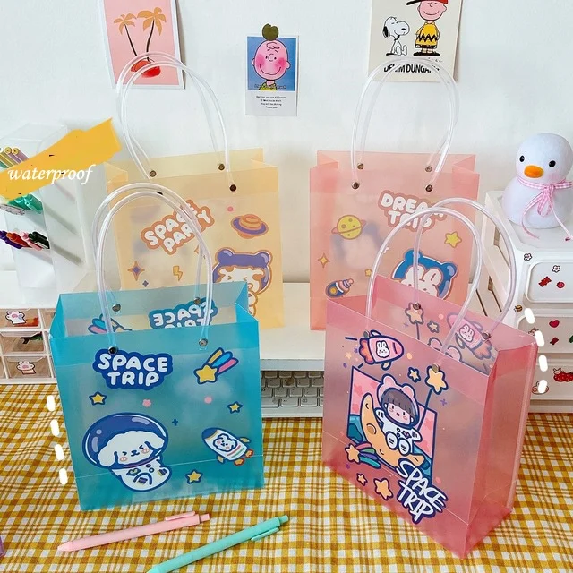 

Cartoon Spaceman Handheld Gift Bag Large Capacity Birthday Gift Packaging Bag Transparent Handbag