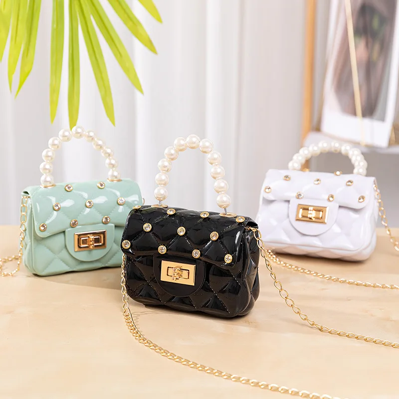 

2021 New Fashion French Elegant Diamond Inlaid Pearl Chain Bag Pvc Children'S Jelly One Shoulder Slanted Span Mini Handbag, Picture