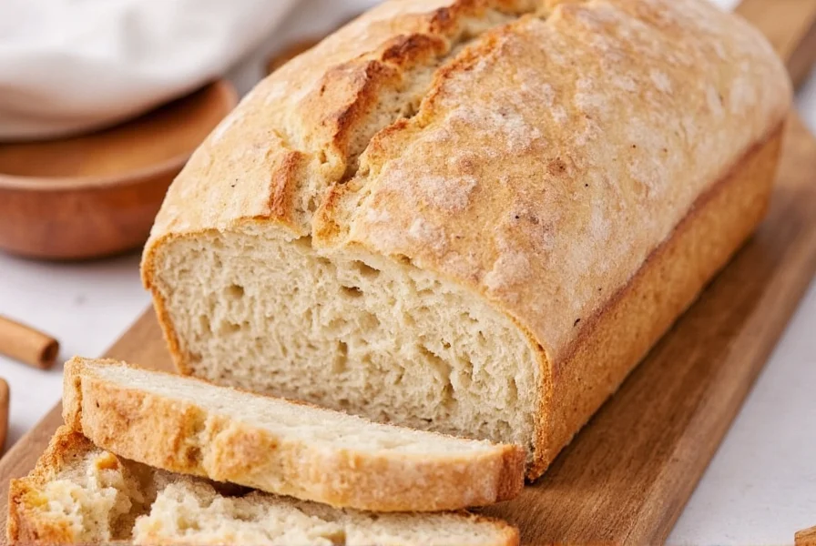 Professional baker laminating cinnamon into sourdough dough during shaping process