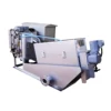 Waste water treatment machine with screw press sludge dehydrator