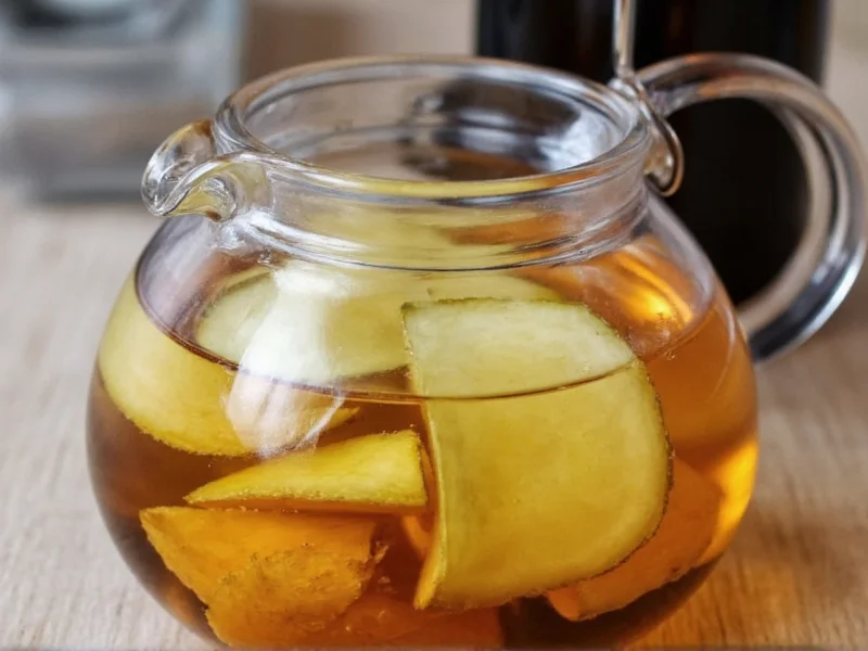 Fresh ginger slices steeping in glass teapot
